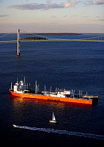 Dockwise yacht transport ship in front of Newport Bridge, Rhode Island, USA. Autumn 2006. Property Released.