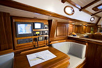 Interior of the Fontaine 53 cruising yacht with navigation desk, Rhode Island, USA. October 2006.