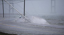 An October 2006 storm freeing yachts from their moorings to run ashore and be pounded by waves in Jamestown, Rhode Island, USA.