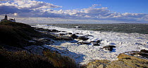 Rough seas during an October 2006 storm, Jamestown, Rhode Island, USA. Beavertail Lighthouse in the background.