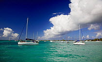 Moored sailing boats under a cloudy sky, British Virgin Islands, Caribbean, December, 2006.