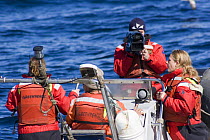 Greenpeace activists in the North Sea, with cameraman.