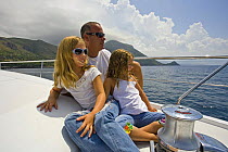 Mr. Chuck Schoninger and his two daughters cruising the Tirrenian sea on board his brand new Pershing 62, Maratea, Italy.