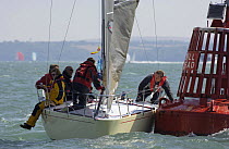 Odd Job, 1/4 Tonner, Class 7 with Paul Treliving hits the Hill Head Buoy during Skandia Cowes Week, Solent, UK, day 6, August 3, 2006.