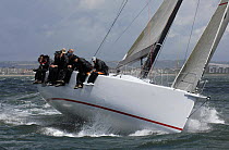 Crew of the TP52 racing yacht "Panthera" hiking out in windy conditions during the Fortis IRC Championships in Cowes. Isle of Wight, UK, June 2007.