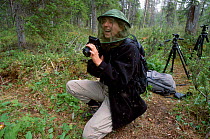 Photographer wearing protection against mosquitoes Finland