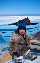 Inuit child wearing Caribou and Seal skin clothes. Nunavut Canadian arctic June 2000