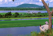 Man looking at view over Pantanal NP World Heritage Site Brazil South America