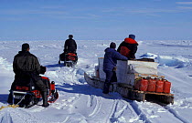 Martha Holmes, Doug Allan and Inuit guides on skidoos Canada