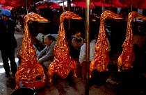 Traditional smoked duck on market stall, Shinling market, Yunnan, China