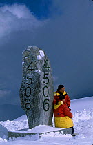 Tourist on summit of Jade Dragon Mountain Peak (4506m) Lijiang, Yunnan, China glacier