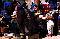 Hani group, communal eating near Grand terraces. Yuanyang, Yunnan, China dark embroidered