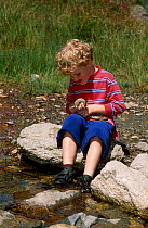 Child with Water snake {Natrix maura} Spain