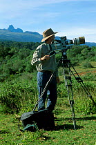 Barrie Britton filming Sunbirds for Life of Birds. Mt Kenya Kenya. September 1997 Golden