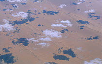 Aerial view of clouds over desert with shadows on land Somalia