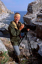 Ben Osborn photographing seabirds. Talan Sea of Okutsk Eastern Russia