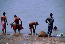 People bathing in Hugli River Calcutta West Bengal India