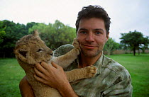 Steve Leonard with lion cub on location in Lion park South Africa
