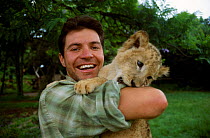 Steve Leonard with lion cub on location in Lion park South Africa